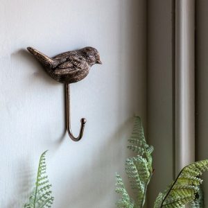 Rustikk og sjarmerende krok med fugl i antikk gull